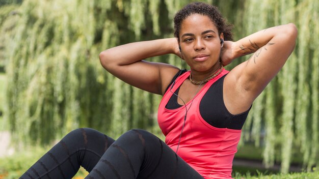 Healthy woman doing exercise outdoors