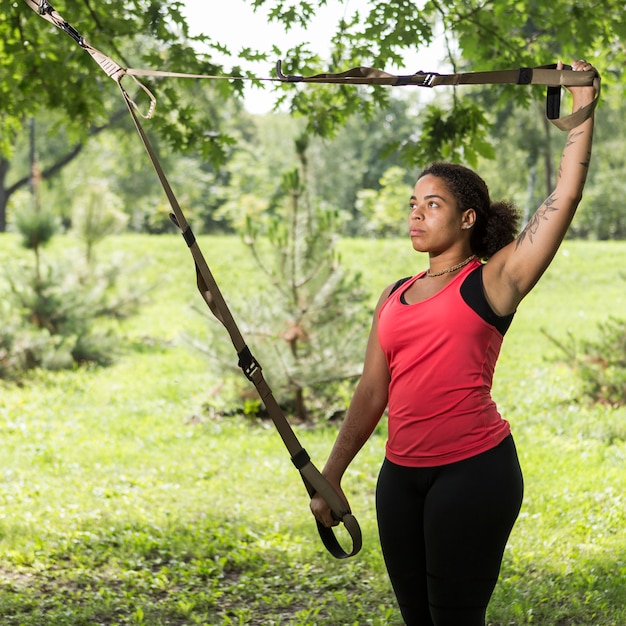 Healthy woman doing exercise outdoors