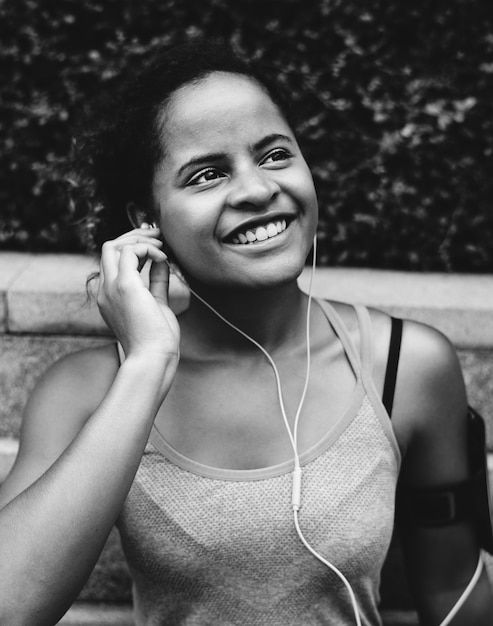 Free Photo healthy woman exercising while using technology