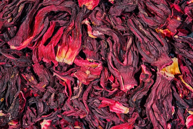 Heap of dry hibiscus tea Background tea dried hibiscus flowers top view