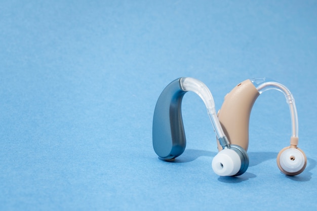 Free photo hearing aids with blue background still life