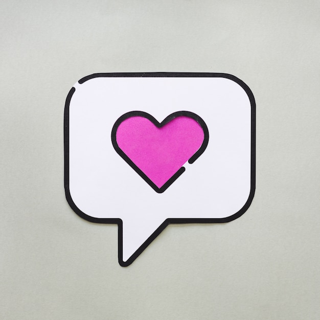 Free Photo heart in bubble speech icon on grey table