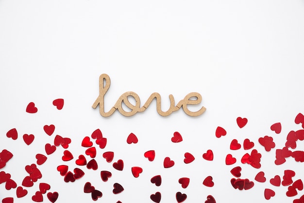 Free Photo heart confetti near love writing