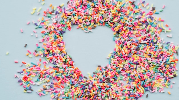 Free photo heart between different bright sweets