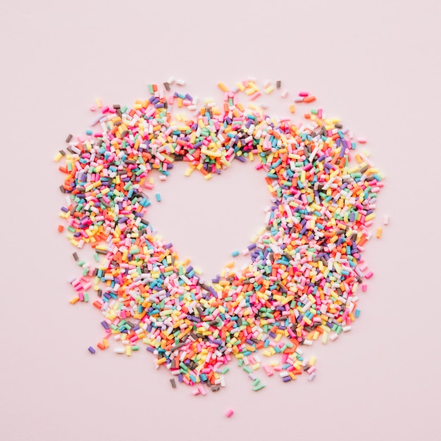 Free Photo heart between different colourful sweets