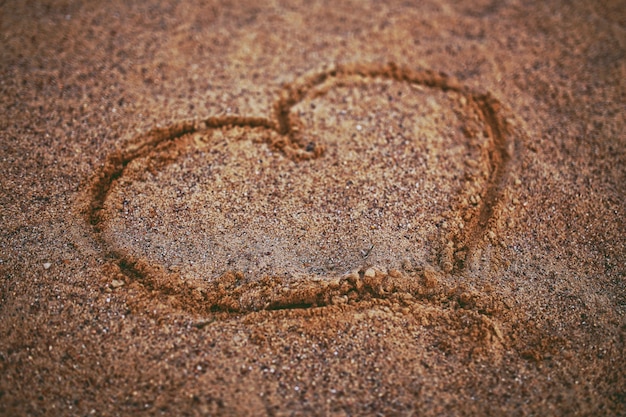 Free photo heart drawn in the sand