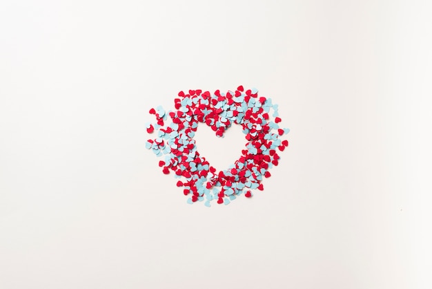 Free photo heart from blue and red confetti