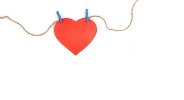 Free Photo heart made of paper on clothespins on a white background isolated