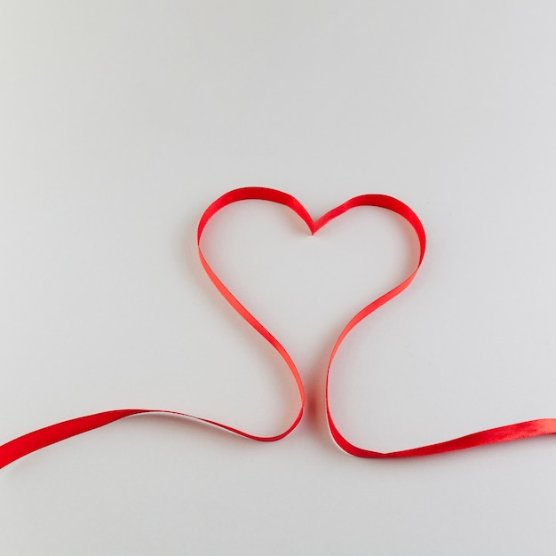 Heart made of red satin ribbon