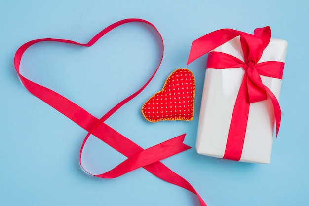 Heart and ribbon near gift