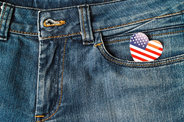 Free photo heart shape american flag in the denim jeans pocket