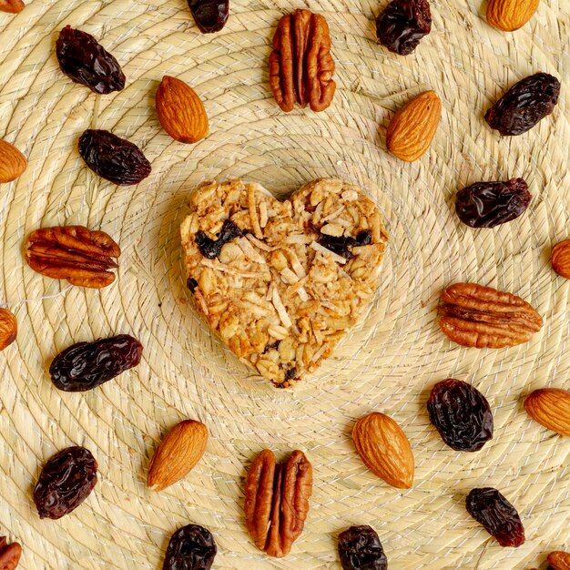 Heart shape cereal with nuts and raisin