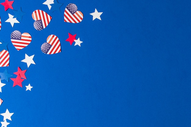 Free photo heart shape usa flags and stars on blue background