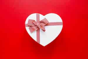 Free photo heart shaped box on bright background