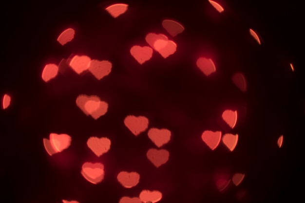 Free Photo heart-shaped lights on black