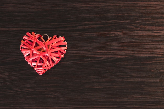 Free photo heart on a wooden table