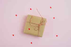 Free photo hearts around gift box