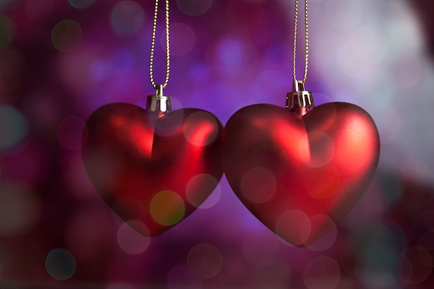 Hearts hanging from a rope with background out of focus