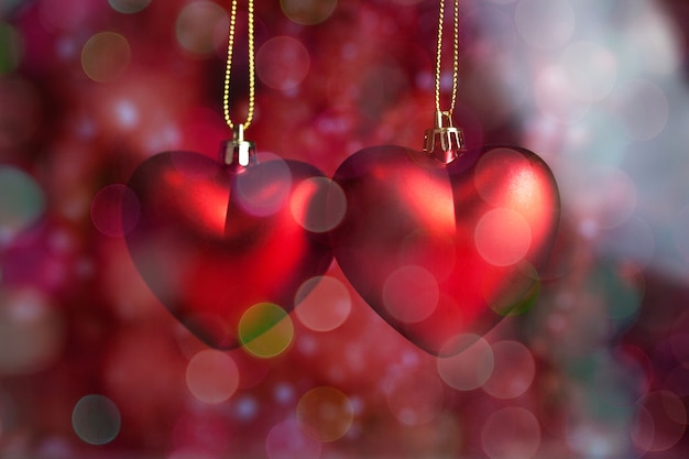 Free Photo hearts hanging from a rope with background out of focus