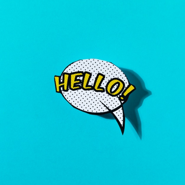 Free Photo hello lettering text in a speech bubble on turquoise backdrop