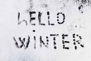 Free photo hello winter text written on snow