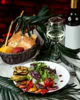 Free photo herbal salad with fried vegetables