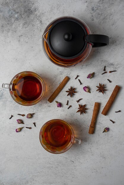 Herbal winter tea in the cups and kettle.