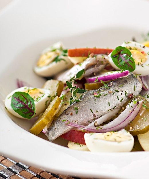 Free photo herring salad, apples and eggs