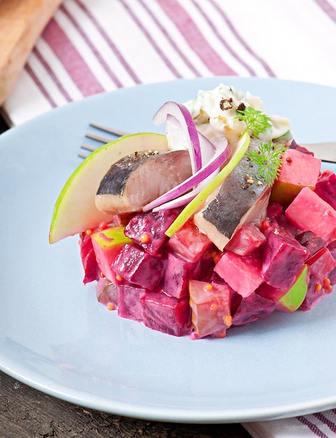 Herring salad with sour cream sauce