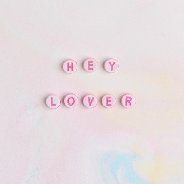 Free photo hey lover beads lettering word typography