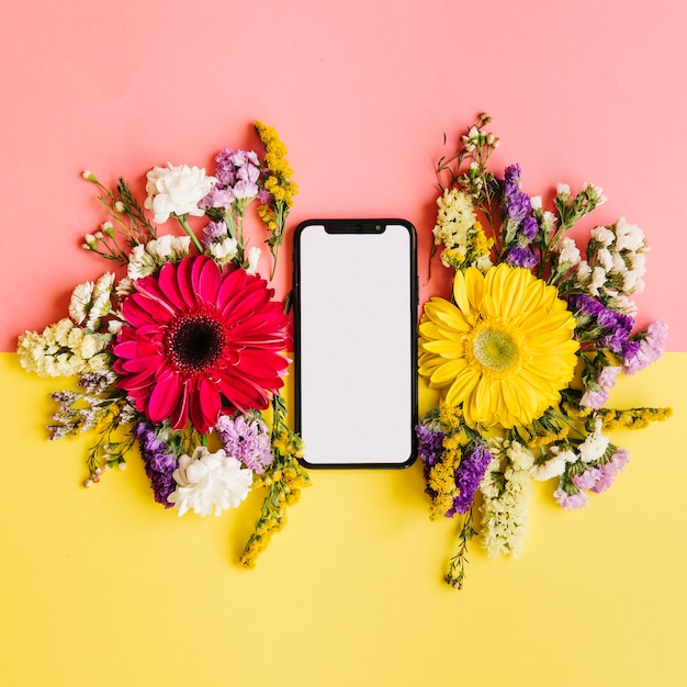 Free Photo hi-tech smartphone and flowers