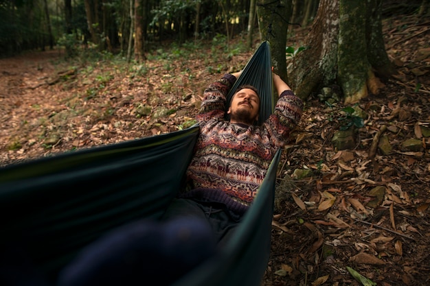 Free photo high angle adventurous man bivouacking