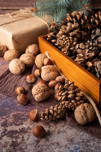 High angle arrangement with nuts and pine cones