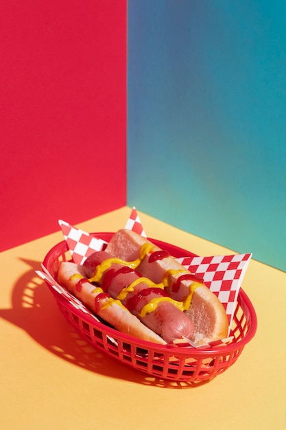 High angle arrangement with tasty hot dog and basket 