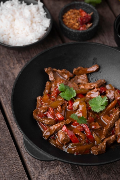 Free photo high angle of asian dish on plate with meat and rice