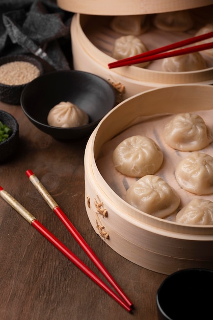 High angle of asian dumplings with chopsticks