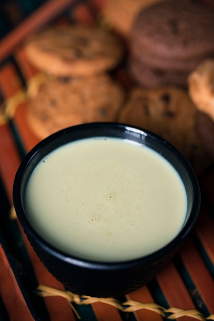 High angle asian tea with biscuits on table