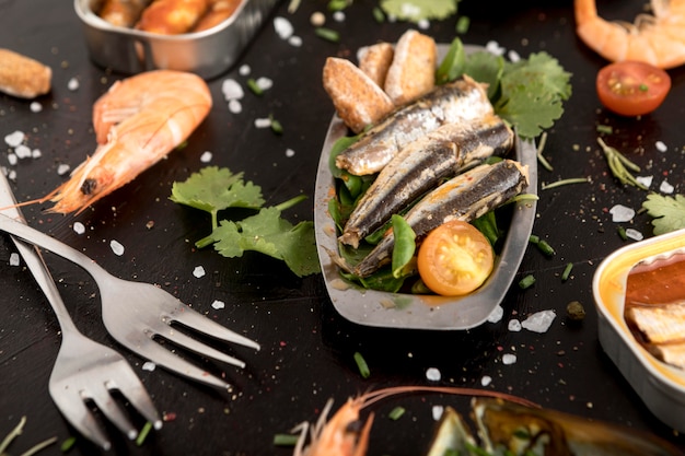 High angle of assortment of seafood with cutlery