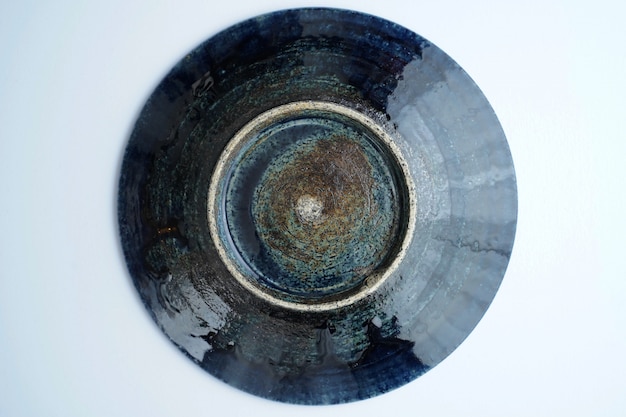 Free Photo high angle of a beautiful vintage ceramic bowl on grey