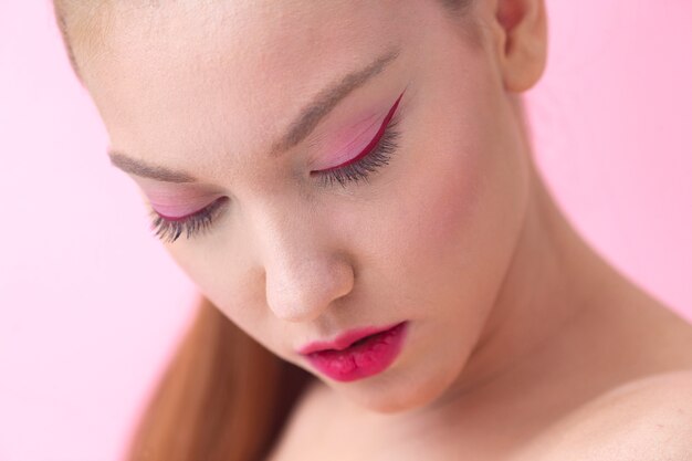 High angle beautiful woman wearing pink makeup