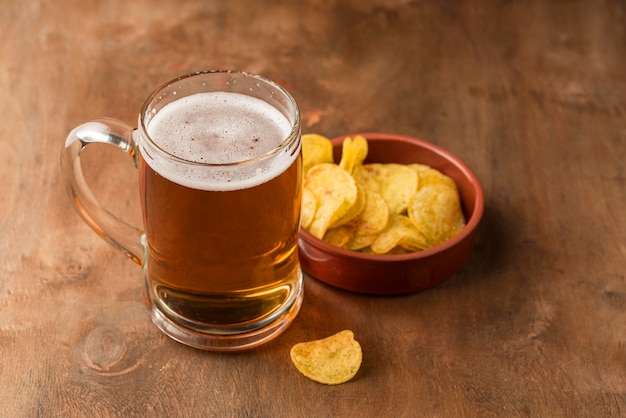 High angle beer mug and chips