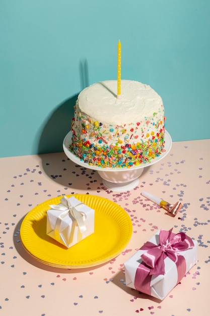 Free photo high angle birthday cake and presents