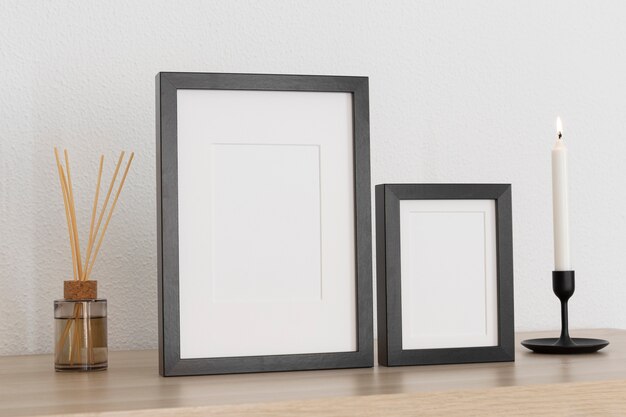 High angle black frames and candle