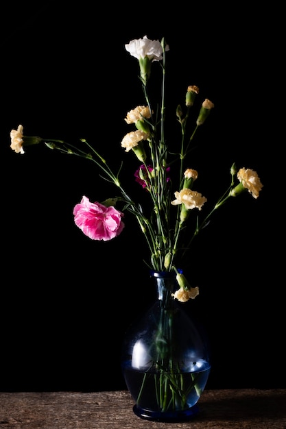 Free photo high angle blossom flowers on vase