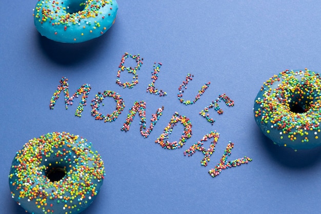 Free Photo high angle blue monday arrangement with doughnuts