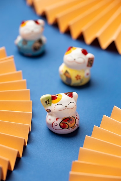 Free photo high angle blurry lucky cats arrangement