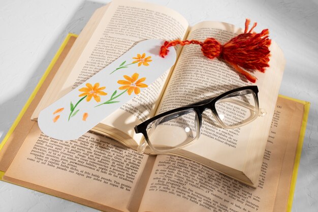 High angle books with floral bookmark