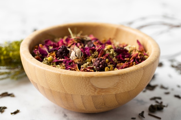 Free Photo high angle bowl with dry flowers