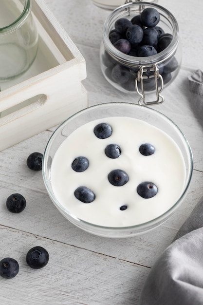 Free photo high angle bowl with yogurt and blueberries