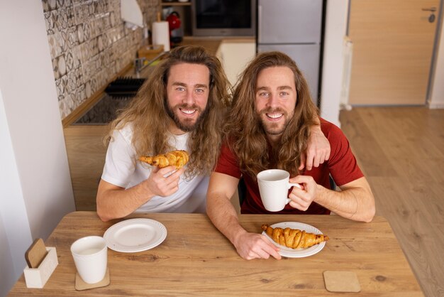 High angle brothers having breakfast